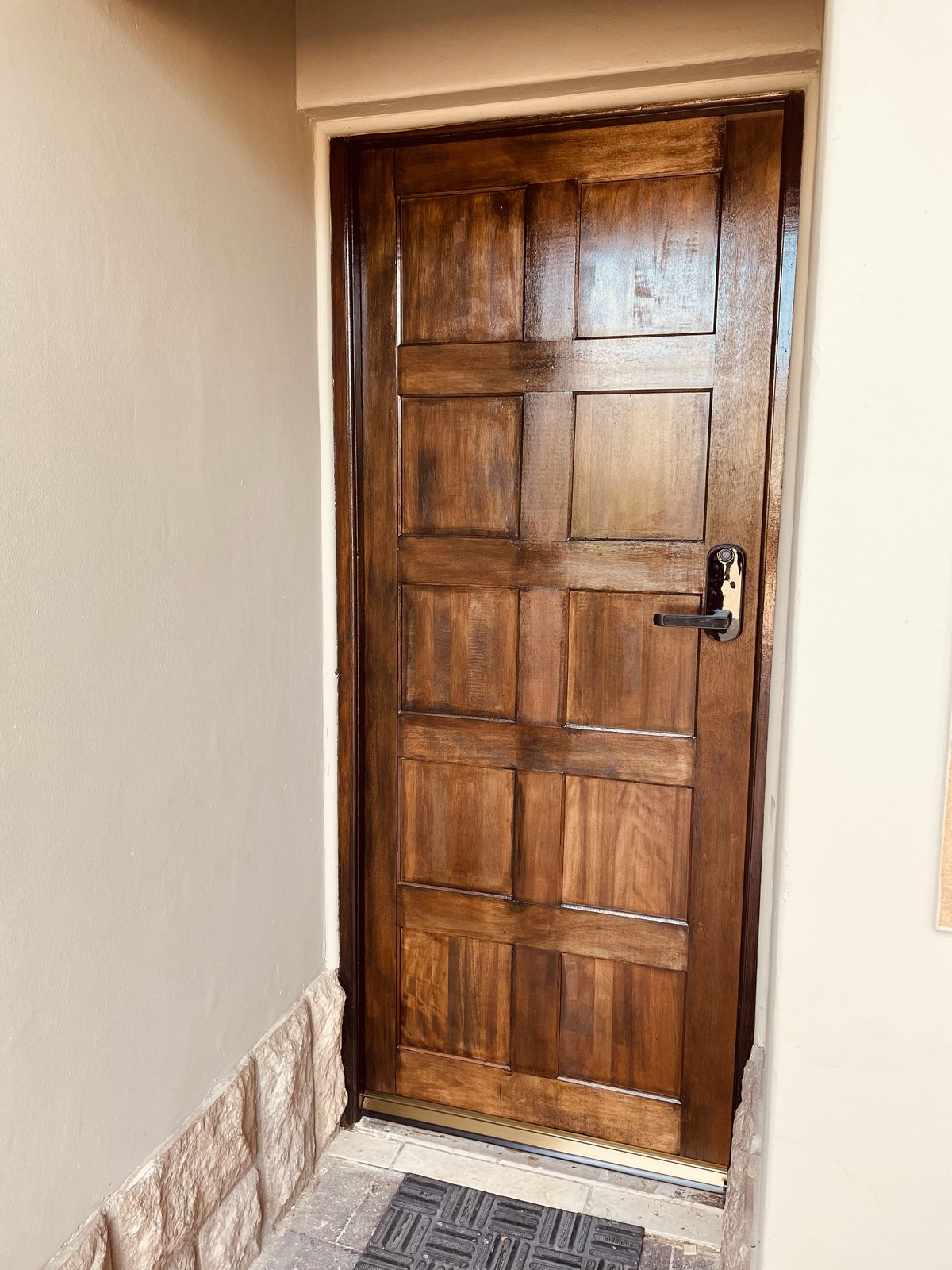 Ebony hard wood door installation with electronic integrated lock handle