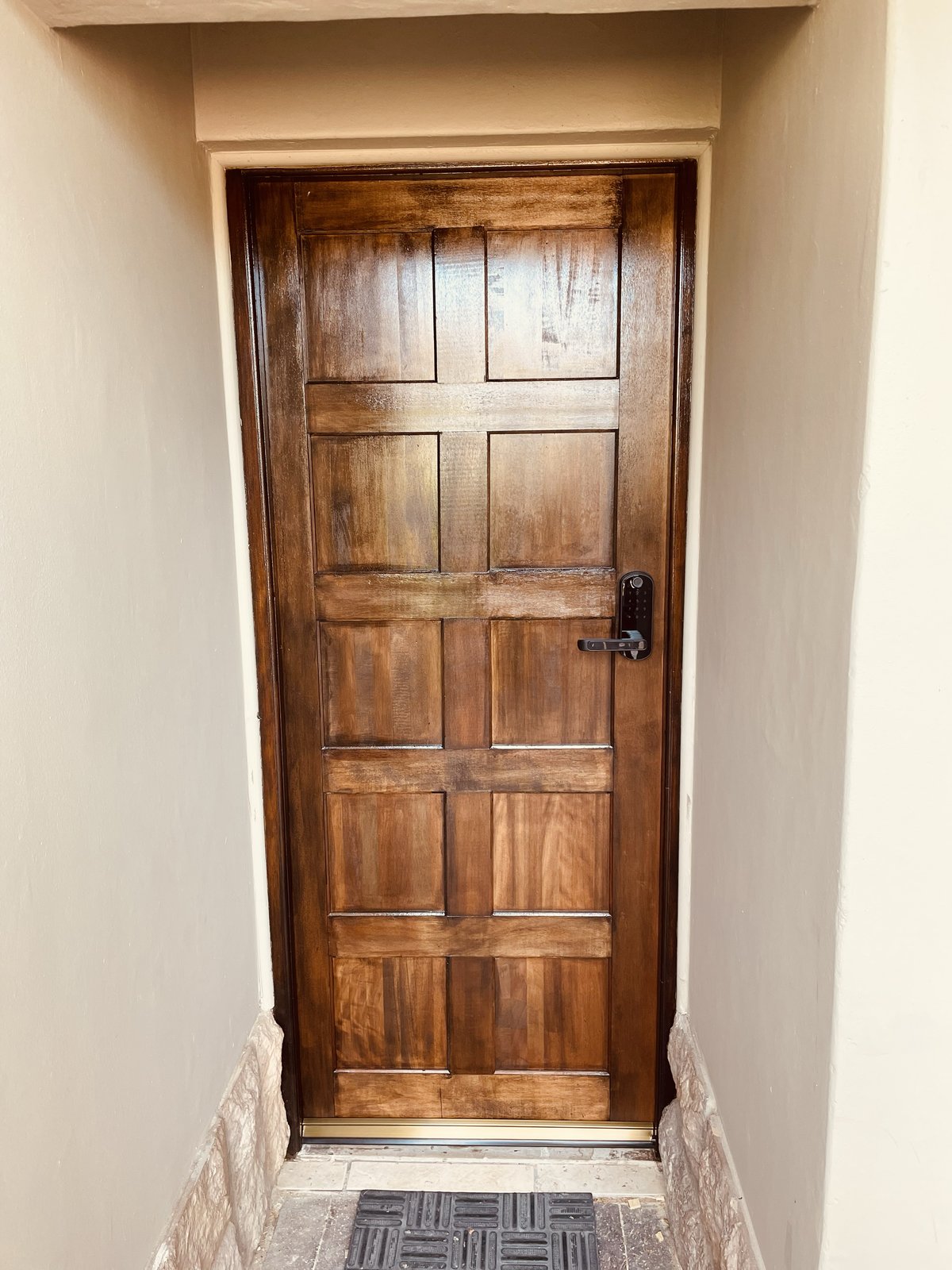 Ebony hard wood door installation with electronic integrated lock handle